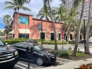 a couple of cars parked in front of a house