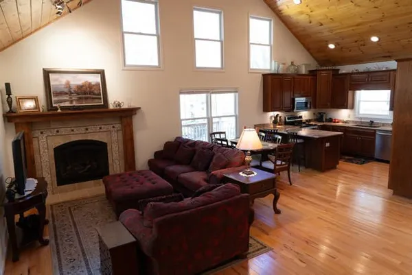 a kitchen with stainless steel appliances granite countertop a sink stove and microwave