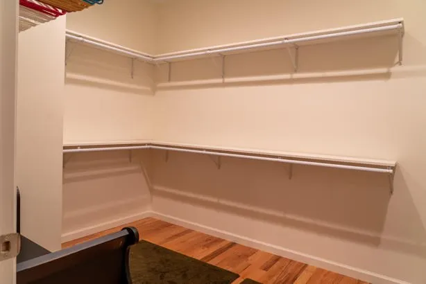 a bathroom with a tub sink and a mirror