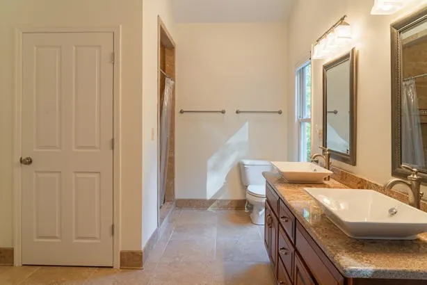 a bathroom with a tub sink and window
