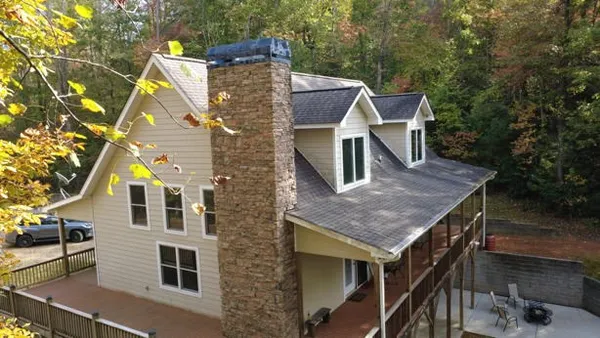a aerial view of a house with a yard