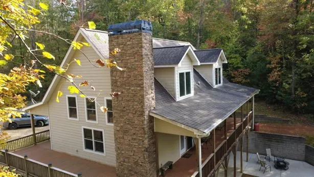 a aerial view of a house with a yard