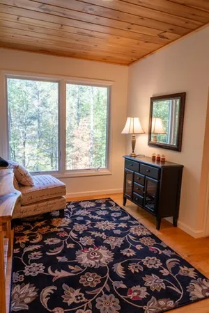 a view of a backyard with table and chairs