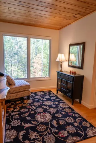 a view of a backyard with table and chairs