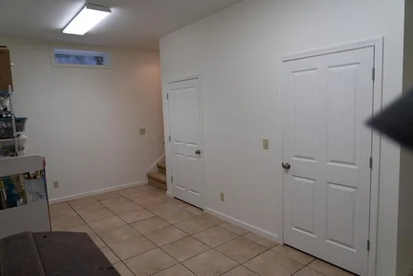 a white toilet sitting next to a bath tub and a shower