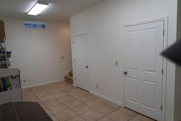 a white toilet sitting next to a bath tub and a shower