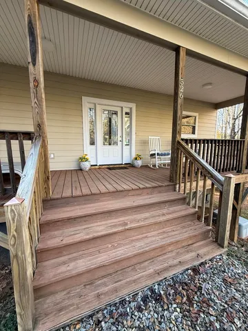 a kitchen with stainless steel appliances granite countertop a stove a sink dishwasher and a microwave oven with cabinets