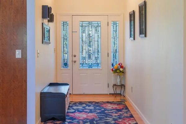 a kitchen with stainless steel appliances granite countertop a stove a sink dishwasher and a microwave oven with cabinets