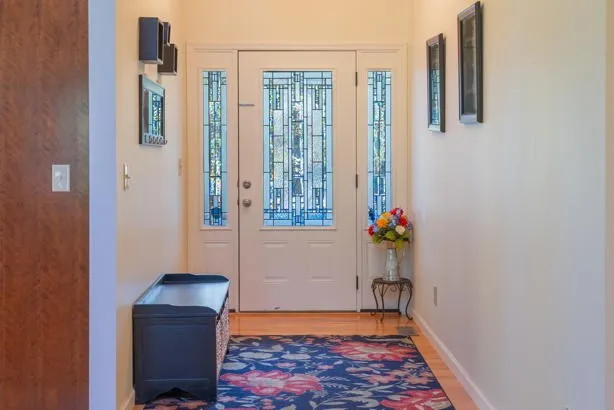 a kitchen with stainless steel appliances granite countertop a stove a sink dishwasher and a microwave oven with cabinets