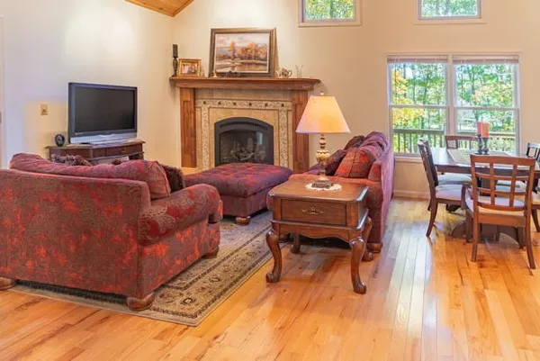 a kitchen with granite countertop a sink a stove and a dining table