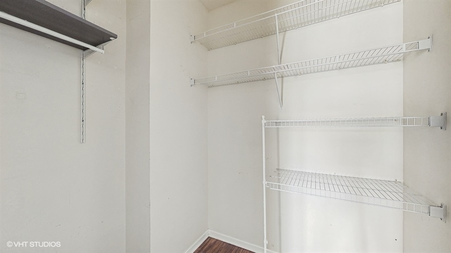 210 North Addison Avenue, Unit 202 Elmhurst, IL 60126 - Photo 12 of 21 a view of a room with racks on the wall