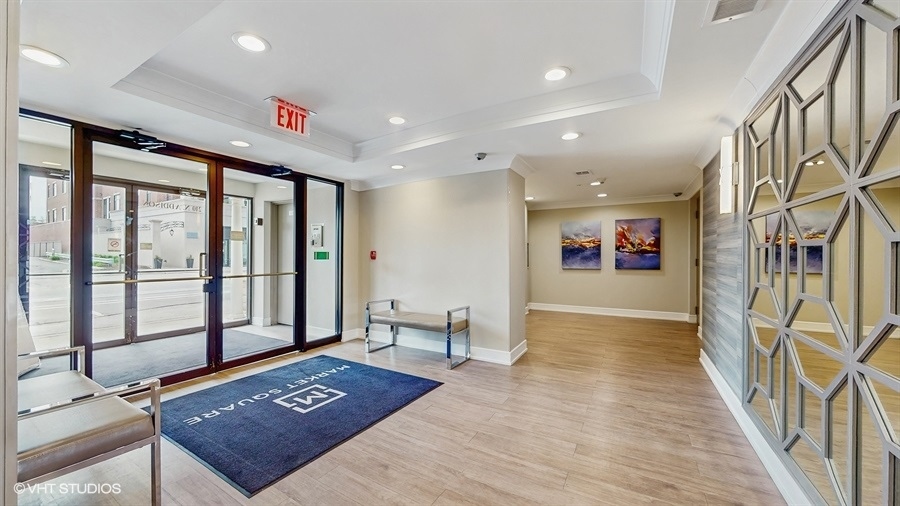 210 North Addison Avenue, Unit 202 Elmhurst, IL 60126 - Photo 18 of 21 a view of an empty room with window and wooden floor