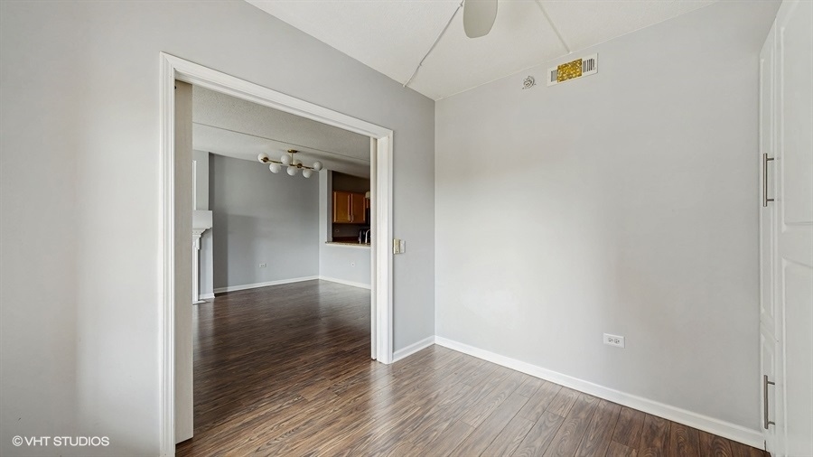 210 North Addison Avenue, Unit 202 Elmhurst, IL 60126 - Photo 7 of 21 a view of hallway with wooden floor