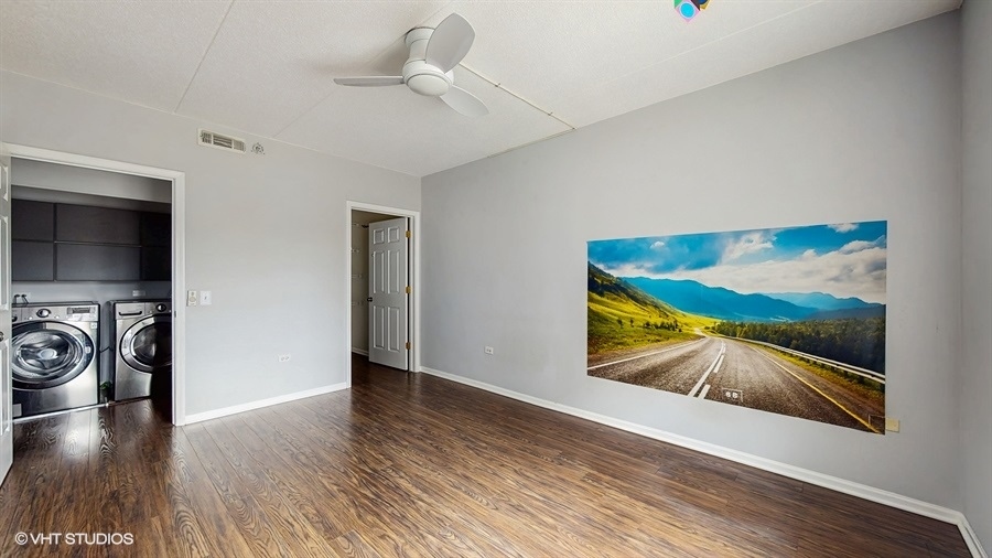 210 North Addison Avenue, Unit 202 Elmhurst, IL 60126 - Photo 10 of 21 a view of a hallway with wooden floor and closet