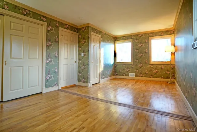 a bathroom with a toilet and a mirror