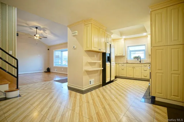 a view of an empty room and wooden floor