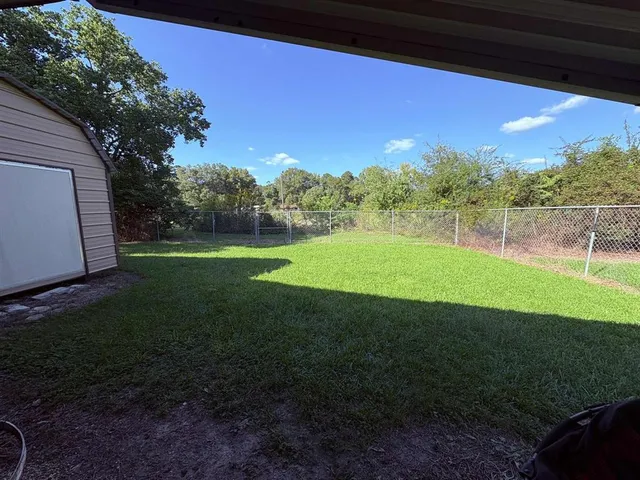 a view of a golf course with a lake