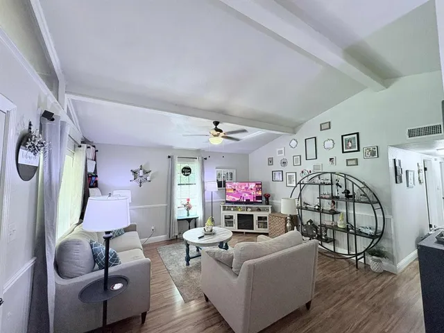 a living room with furniture and a window