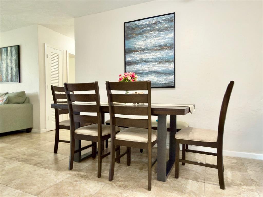 4510 Northwest 46th Street Tamarac, FL 33319 - Photo 13 of 34 a view of a dining room with furniture and window