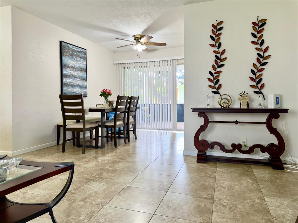 4510 Northwest 46th Street Tamarac, FL 33319 - Photo 14 of 34 a dining room with furniture and window