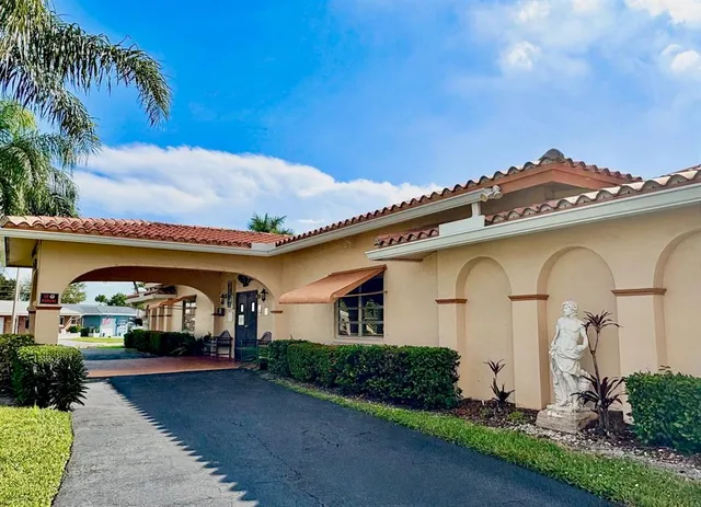 a swimming pool with outdoor seating and yard