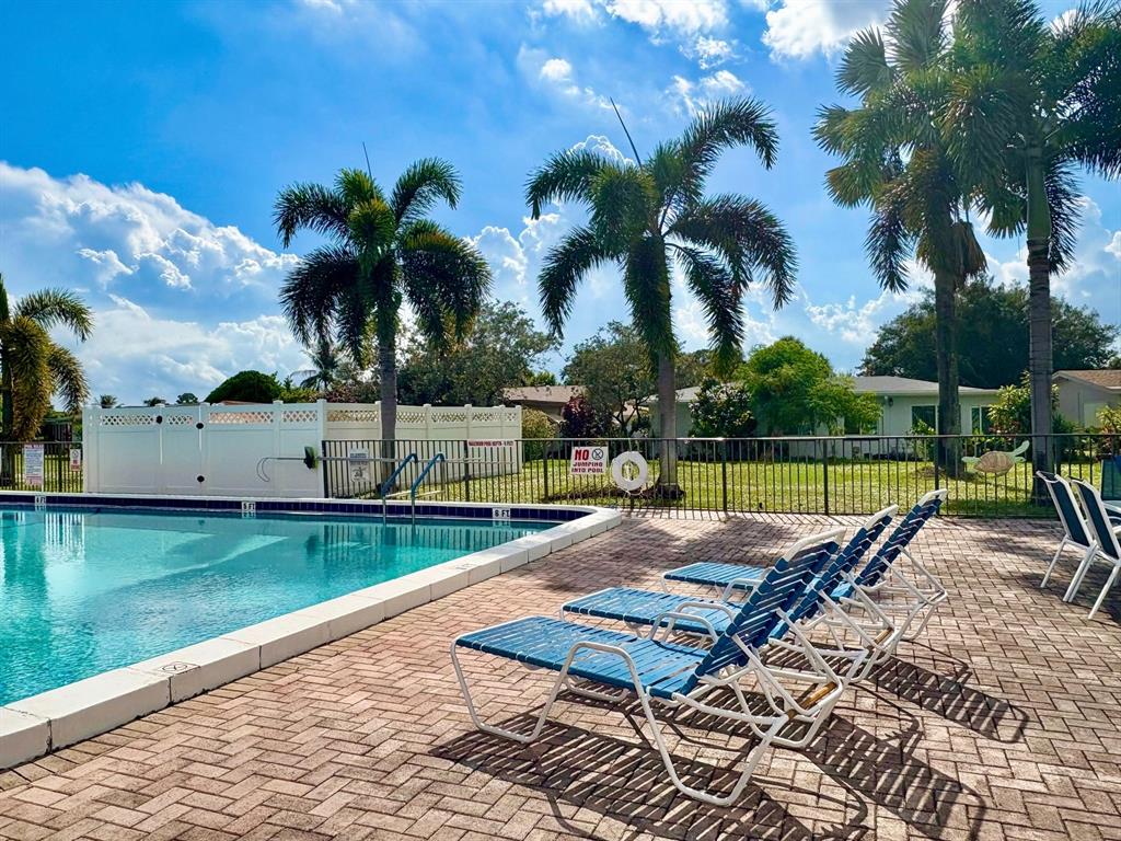 4510 Northwest 46th Street Tamarac, FL 33319 - Photo 28 of 34 a view of a backyard with swimming pool