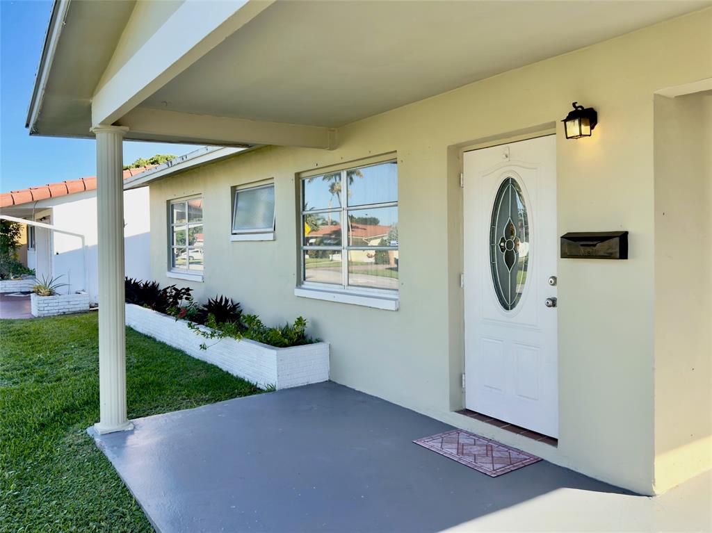 4510 Northwest 46th Street Tamarac, FL 33319 - Photo 3 of 34 a view of a door front of house