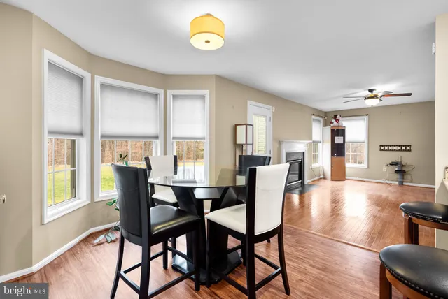 a view of a dining room with furniture and window