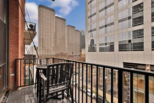 a couple of cars parked in front of building