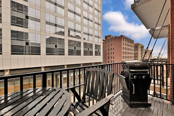 a view of a balcony with chairs