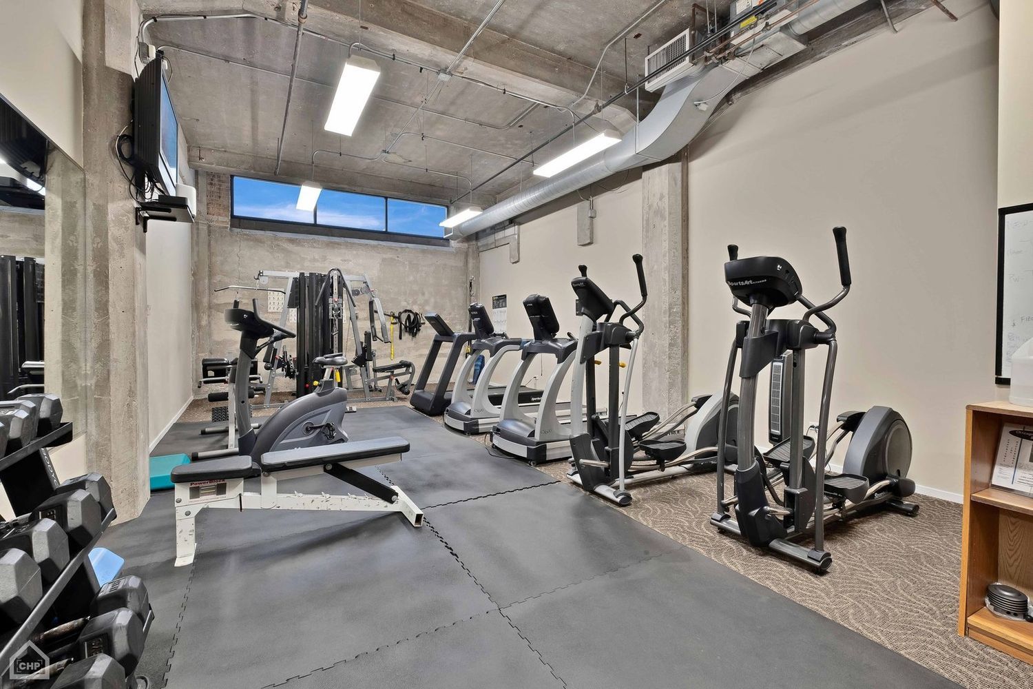 210 South Desplaines Street, Unit 404 Chicago, IL 60661 - Photo 21 of 22 a view of a room with gym equipment