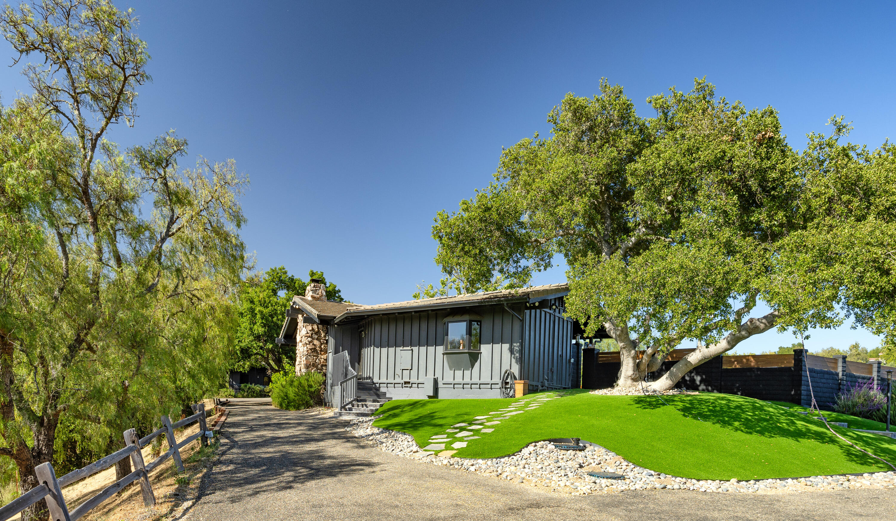 4001 Long Valley Road Santa Ynez, CA 93460 - Photo 26 of 43 a front view of a house with a yard and trees