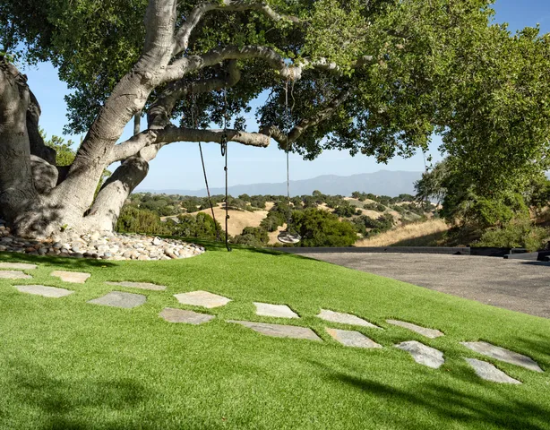 a backyard of a house with lots of green space