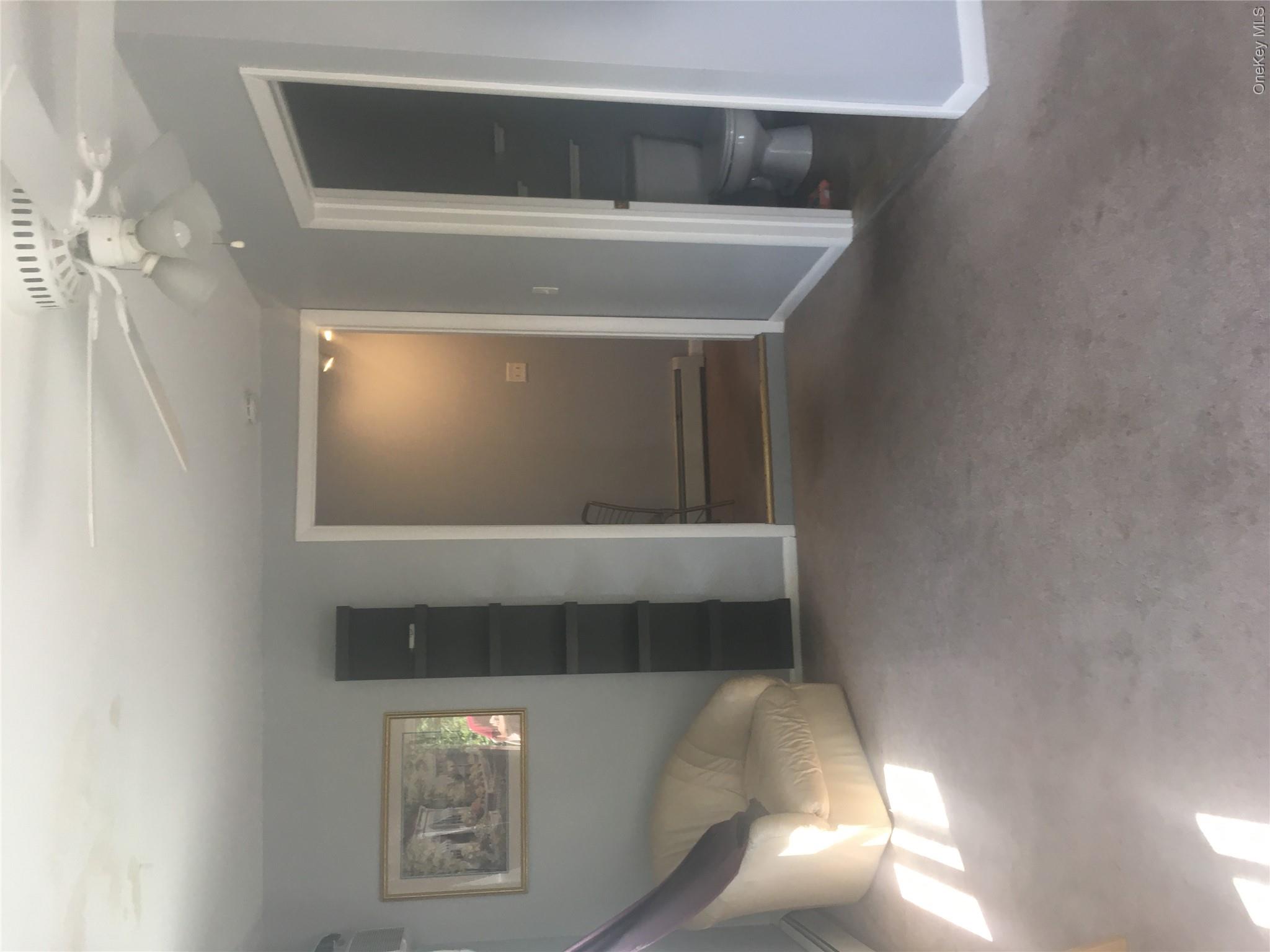 67 Bethlehem Road New Windsor, NY 12553 - Photo 7 of 19 Additional living room, baseboards, a baseboard heating unit, and carpet floors