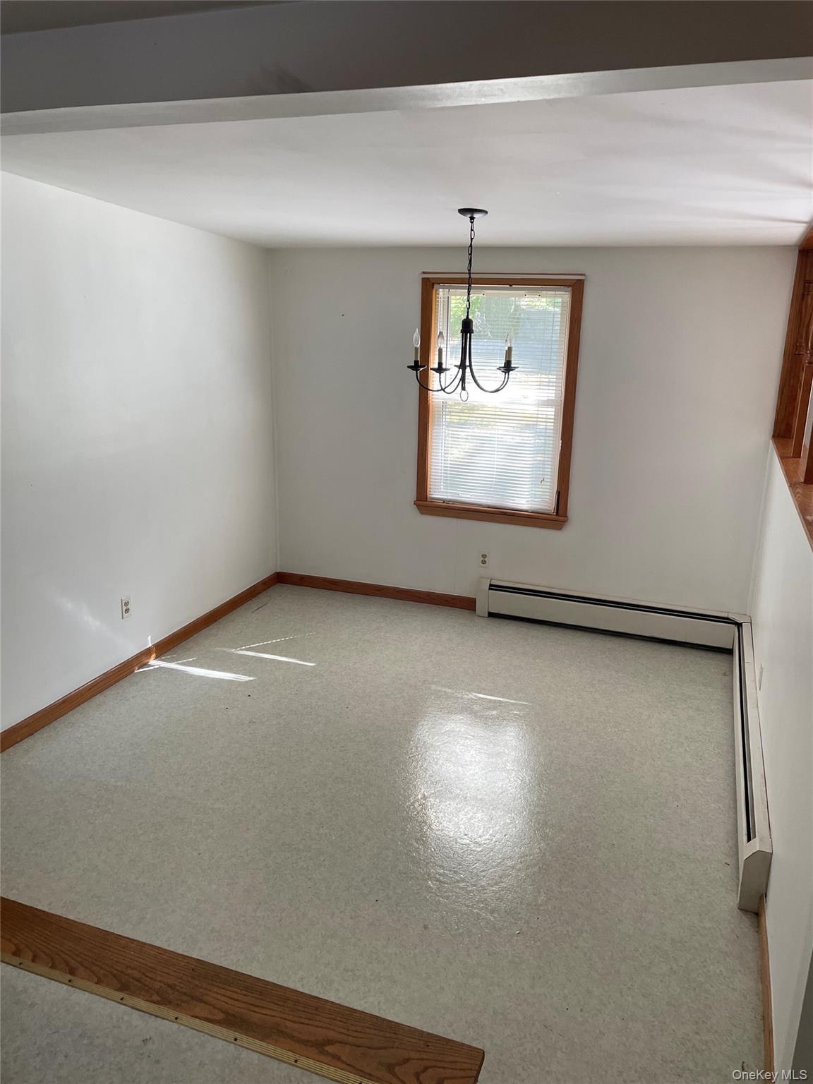 67 Bethlehem Road New Windsor, NY 12553 - Photo 10 of 19 Unfurnished dining area featuring a chandelier and a baseboard radiator
