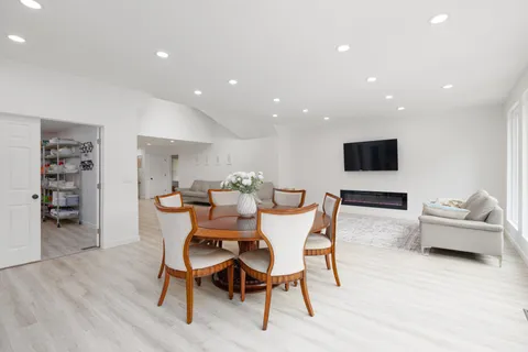 a living room with furniture and a table