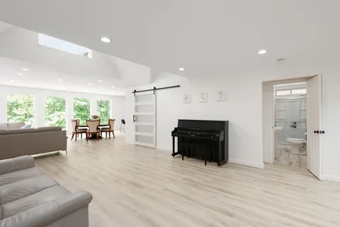 a view of a chair and table on the deck