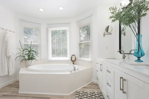 a bedroom with bed and a window