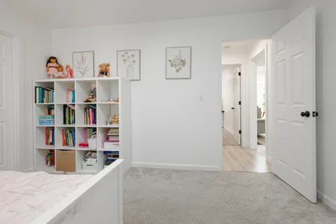 a front view of a house with a yard table and chairs