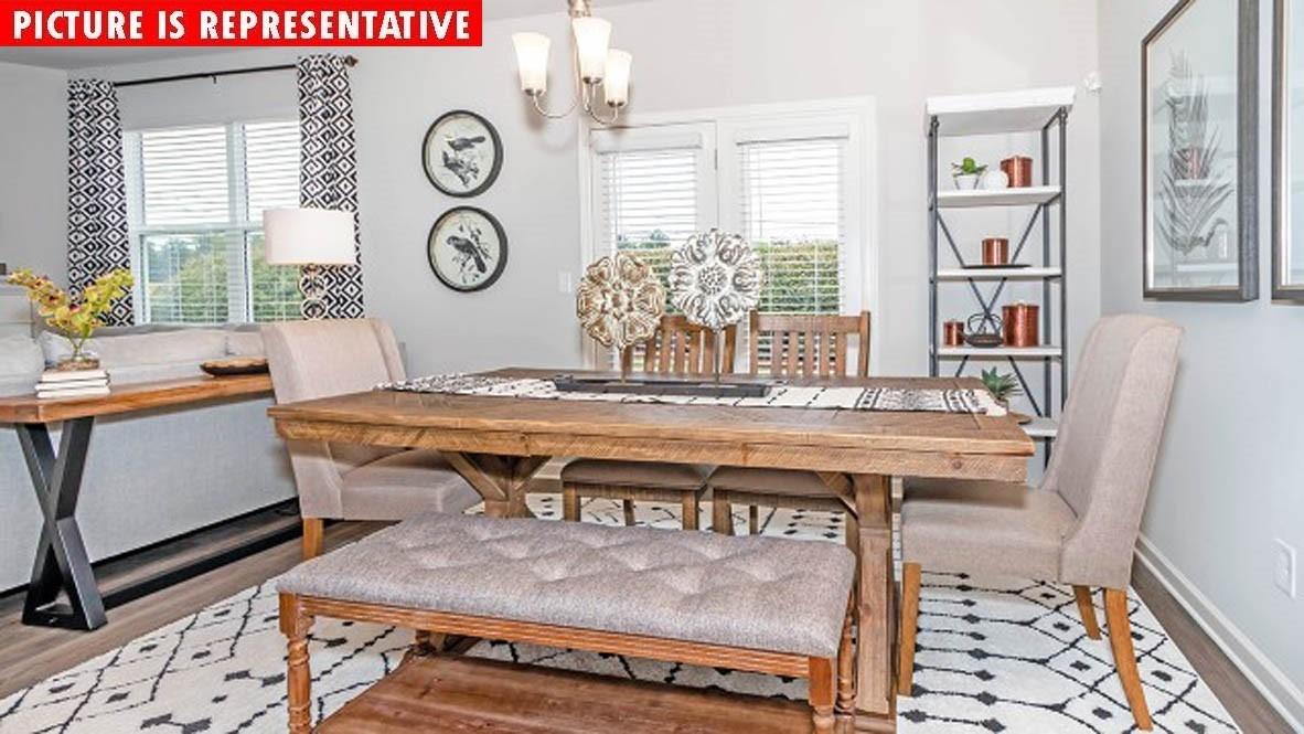 115 Flame Azalea Court Locust, NC 28097 - Photo 12 of 22 a view of a table and chairs in a room