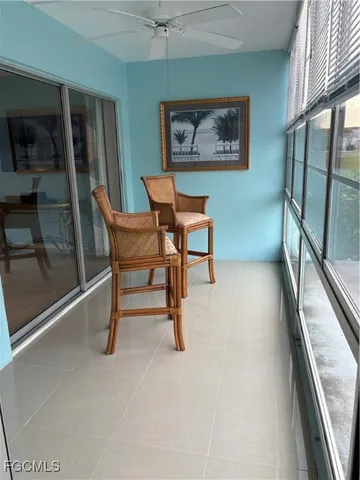 a view of a livingroom with furniture and a window