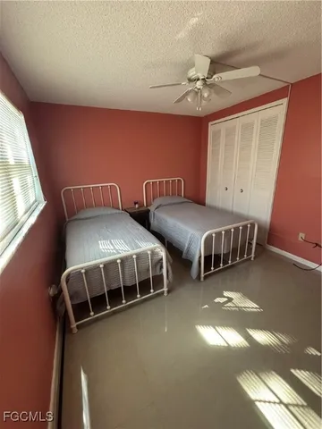 a bedroom with two beds and painted walls