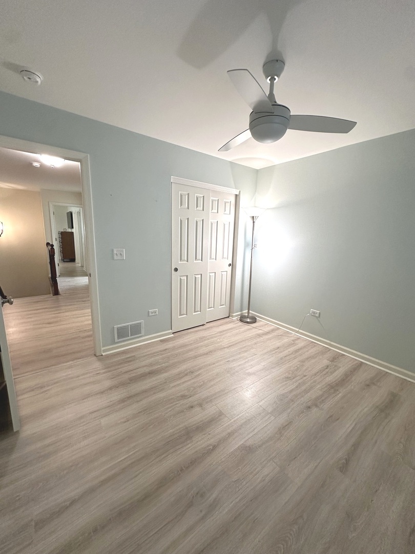 5102 Monroe Street Matteson, IL 60443 - Photo 38 of 54 a view of empty room with wooden floor