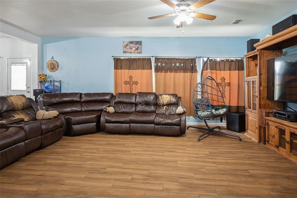324 Fairgrounds Lane Ponder, TX 76259 - Photo 3 of 40 a living room with furniture flat screen tv and a window