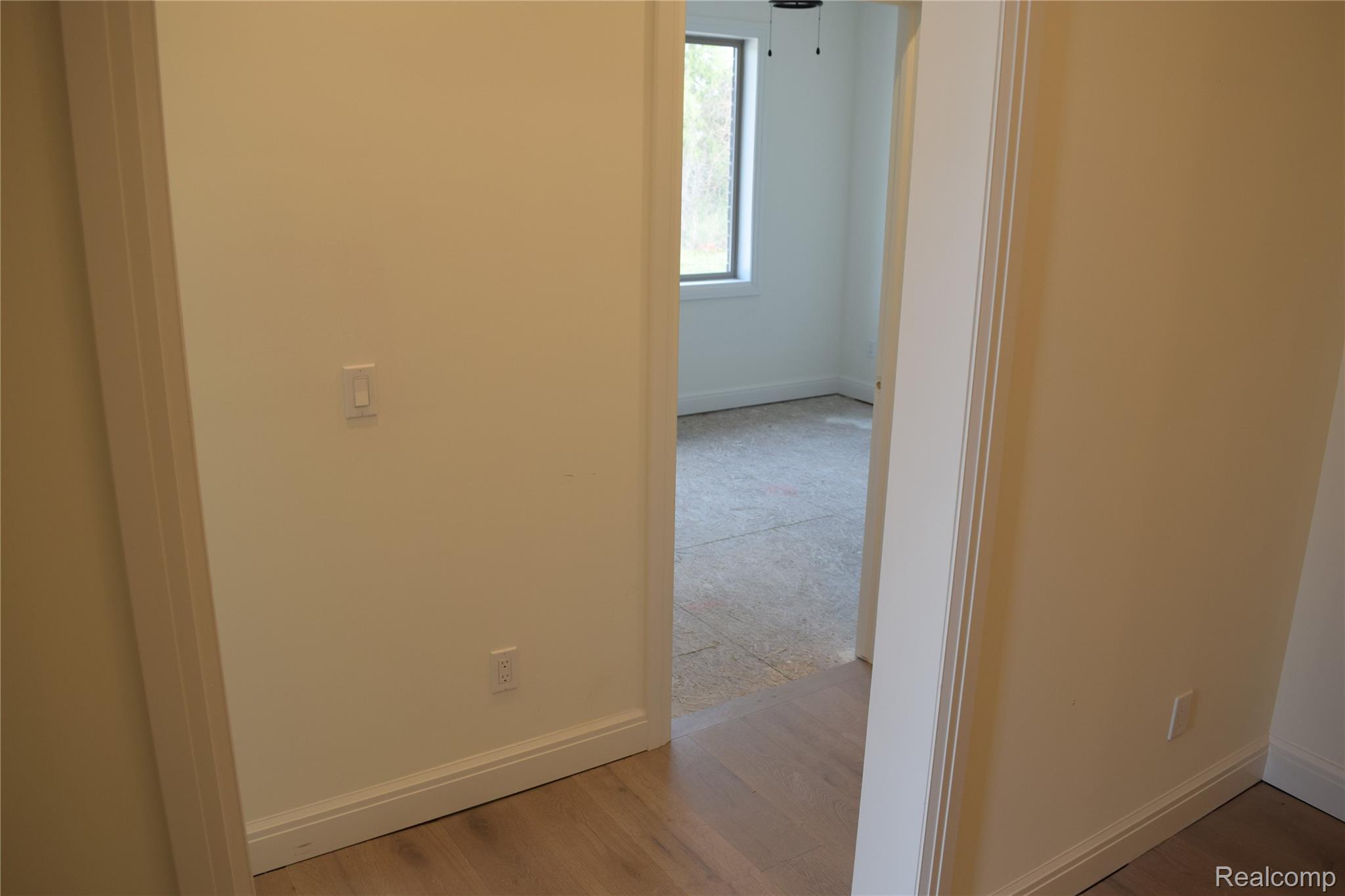 3093 Raffler Drive Rochester, MI 48307 - Photo 30 of 34 Corridor with light wood floors