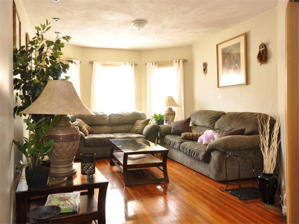 21 Taft Street Boston, MA 02125 - Photo 2 of 9 a living room with furniture and a window