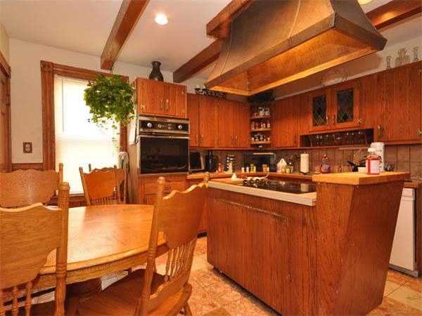 21 Taft Street Boston, MA 02125 - Photo 3 of 9 a kitchen with sink and refrigerator