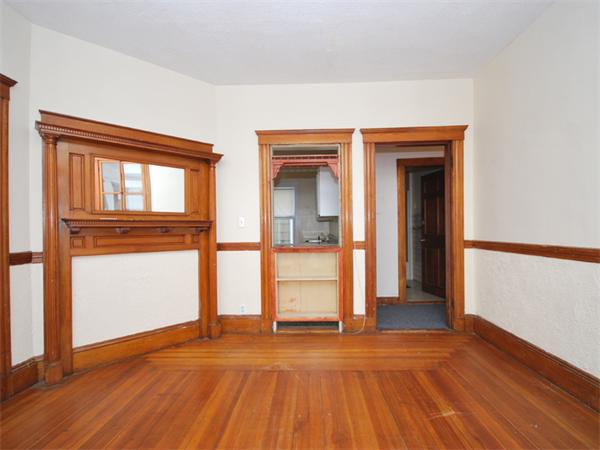 21 Taft Street Boston, MA 02125 - Photo 5 of 9 a view of empty room with wooden floor and fan
