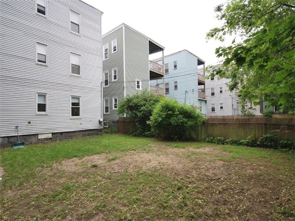 21 Taft Street Boston, MA 02125 - Photo 9 of 9 a front view of a house with garden