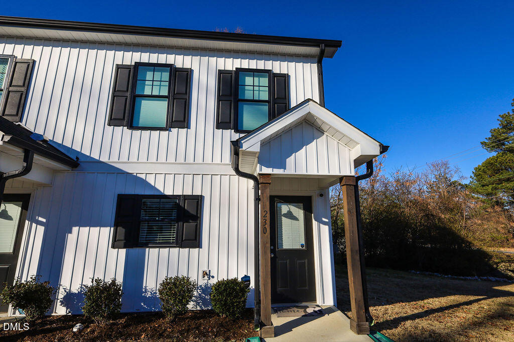 230 South Raleigh Street Angier, NC 27501 - Photo 2 of 38 a front view of a house with garden